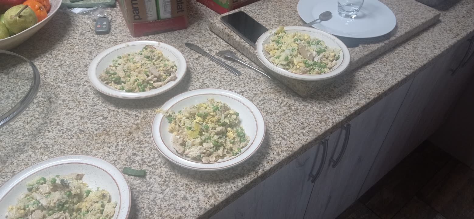 four bowls of fried rice plated on the counter